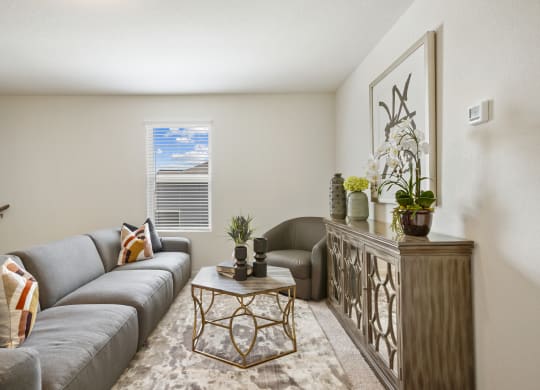 Maple model upstairs loft with a gray couch and a coffee table at Beacon at Ashley River Landing in Summerville, SC