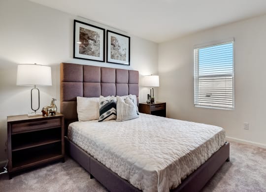 a bedroom with a large bed and two nightstands at Beacon at Meridian, San Antonio