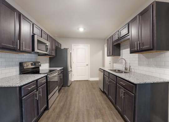 Model 2 Kitchen at Capital Grand Apartments in Tallahassee, FL