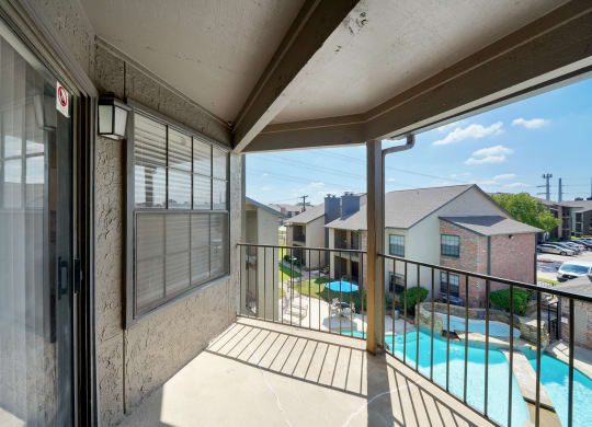 Balcony with Pool View at Polaris Apartment Homes in Irving, Texas, TX