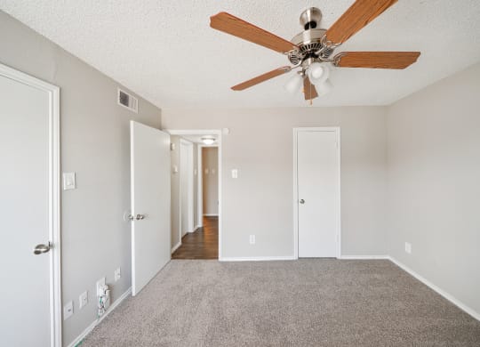 Bedroom with Ceiling Fan at Polaris Apartment Homes in Irving, Texas, TX