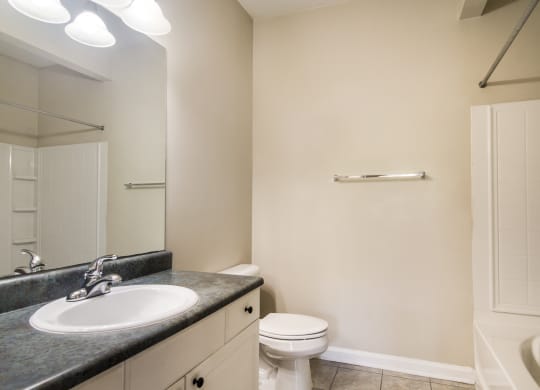 Clean and modern bathroom with essential amenities at Angel Landing apartments in Pensacola, FL
