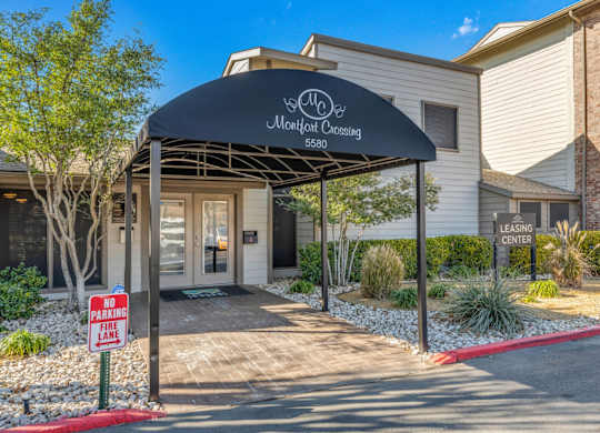 The front of a leasing center with a "No Parking" sign.