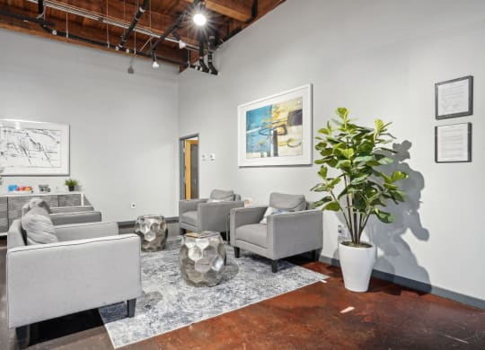 Deep Ellum Lofts leasing office with single seater couches and a snack bar | Deep Ellum Lofts in Dallas, TX