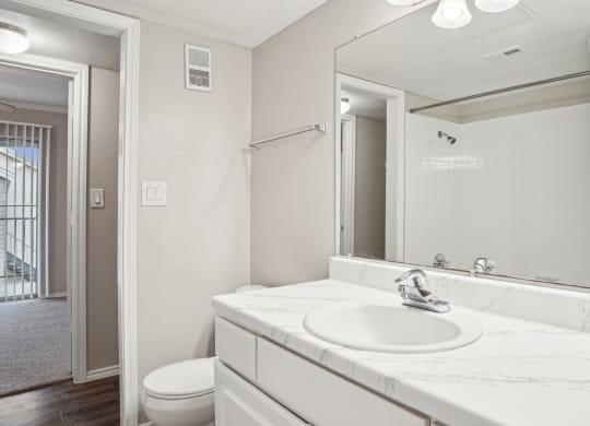 Unfurnished A4 floor plan bathroom with a sink, mirror and a toilet Noel on The Parkway in Dallas, TX