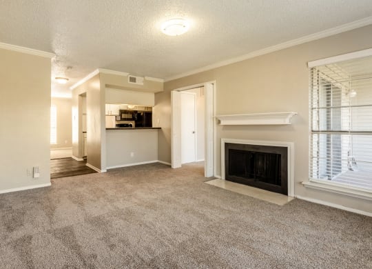 Vacant Living Room with Fireplace at Noel on the Parkway Apartments in Dallas, Texas, TX