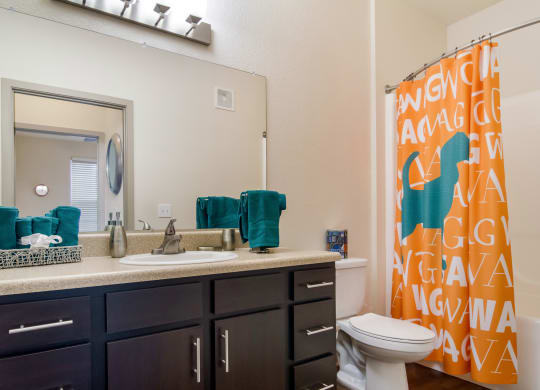 Bathroom with a large mirror at Oakleaf Plantation in Jacksonville, FL
