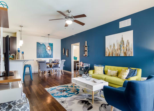Cpzy living room with blue walls at Oakleaf Plantation in Jacksonville, FL