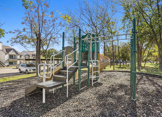 Our playground with a slide at On the Green apartments in Austin, TX