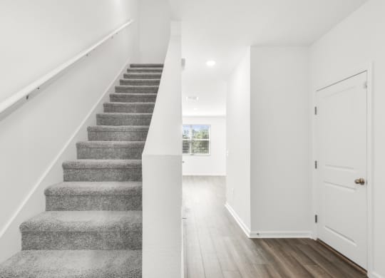 a bedroom with a staircase in a 555 waverly unit