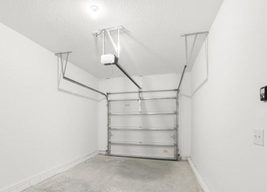 spacious garage with white walls and bright light