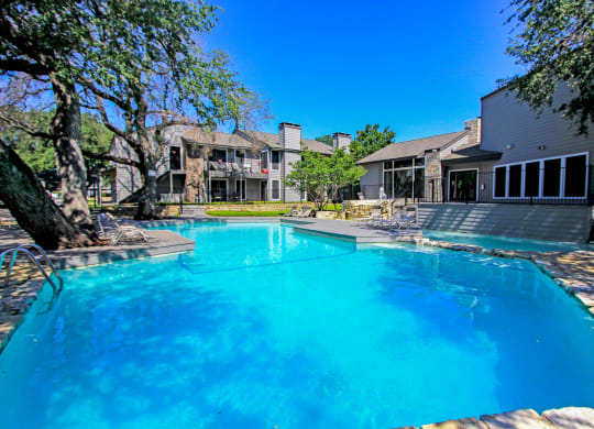 pool in front of apartment building at Westdale Parke in Austin, TX