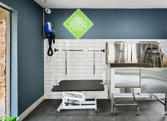 a kitchenette with a sink and a stretcher