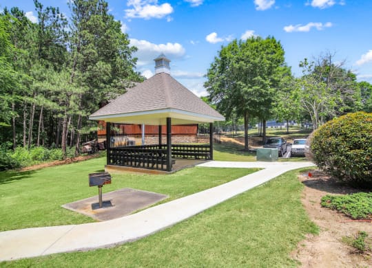 the gazebo with pathway next to it and grass at Grand Reserve at Columbus Apartments in Columbus, Georgia, GA