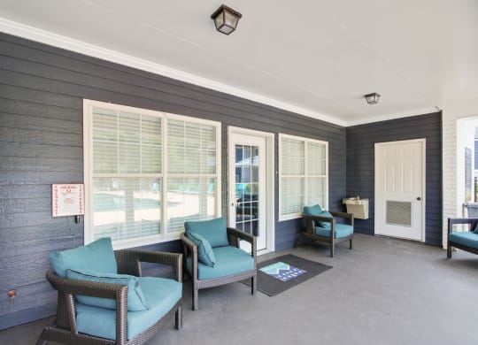 a patio with chairs and a table at Grand Reserve at Columbus Apartments in Columbus, Georgia, GA