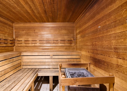 a wooden sauna with two benches and a table at Grand Reserve at Columbus Apartments in Columbus, Georgia, GA