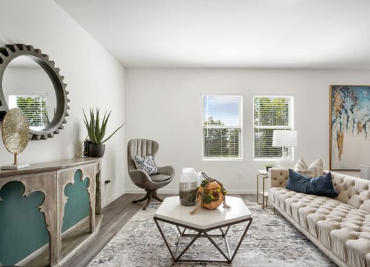 Redbud living room with plenty of natural lighting at Beacon at Ashley River Landing in Summerville, SC