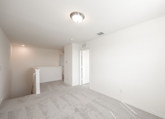 a bedroom with white walls and carpet  at Beacon at Meridian, San Antonio, TX 78245