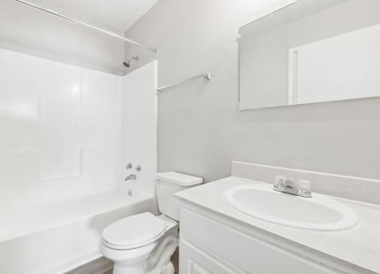 Bathroom with shower, sink and toilet in B1 floor plan at Riverwood Crossing apartments in Roswell, GA.