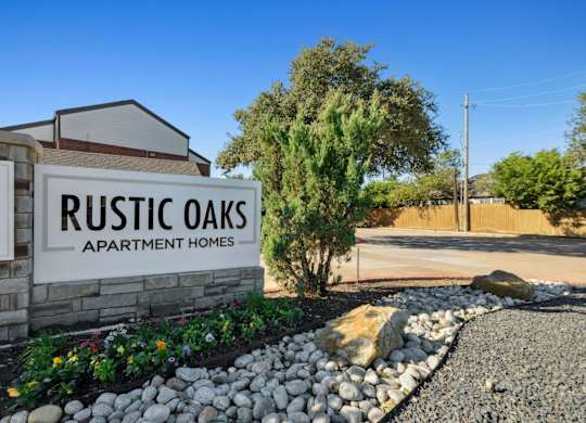 Rustic Oaks Apartments in Wylie, Tx property sign