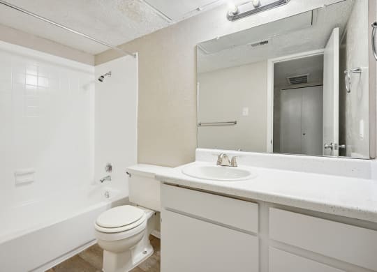 a bathroom with a sink toilet and bathtub