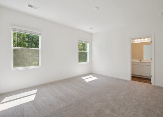 Sequoia master bedroom with two windows at Beacon at Ashley River Landing in Summerville, SC