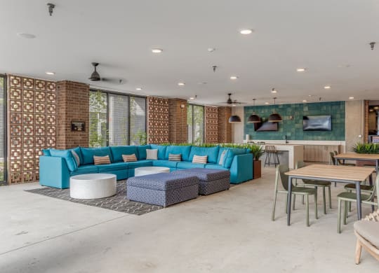Outdoor lounge with couch and chairs at St. Elmo Apartment in Austin, TX