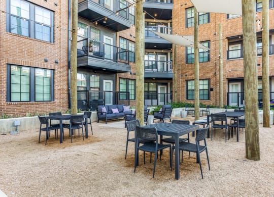 Outdoor Social Space with Comfortable Seating at St. Elmo Apartment in Austin, TX