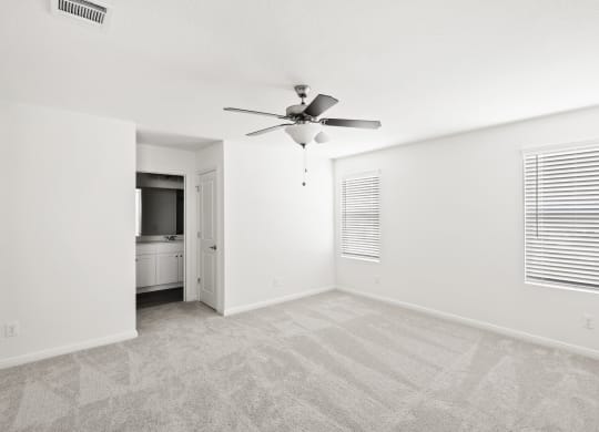 an empty bedroom with a ceiling fan at Beacon at Bunton Creek, Texas, 78640