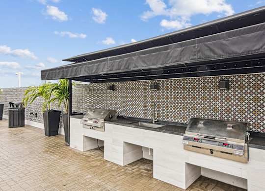 Grilling area with 2 BBQ grills at Twenty2 West luxury apartments in Miami, FL