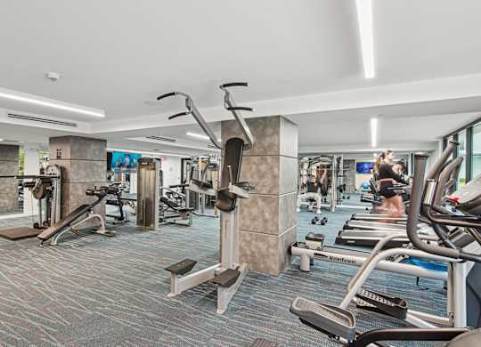 Fitness center with a variety of strength and cardio equipment at Twenty2 West luxury apartments in Miami, FL
