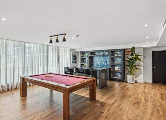 A pool table is in the Gaming Zone at Twenty2 West luxury apartments in Miami, FL