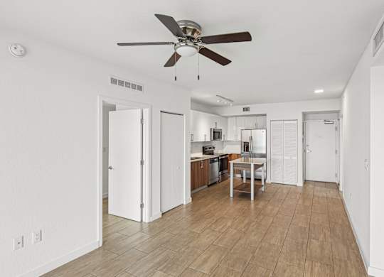 Twenty3 floor plan living room with a ceiling fan and wooden floors at Twenty2 West luxury apartments in Miami, FL