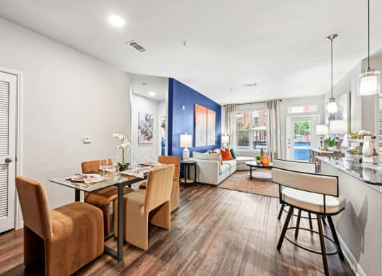 Dining area and living room with modern decor at The Grand at Upper Kirby apartments in Houston, TX