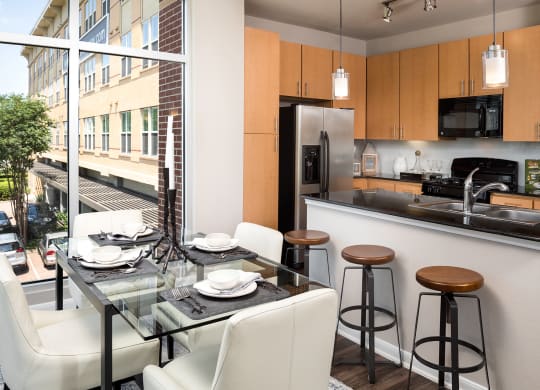 Luxury Kitchen and Dining Area at The Grand at Upper Kirby | Apartments in Houston, TX