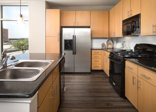 Kitchen with Modern Appliances at The Grand at Upper Kirby | Apartments in Houston, TX