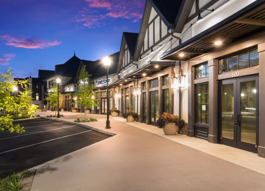 side view of the building at twilight at The Alastair at Aria Village Apartment Homes in Sandy Springs, Georgia, GA