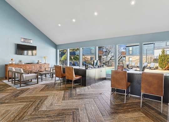 A leasing office with chairs and a counter at Vine Apartments in Arlington, TX