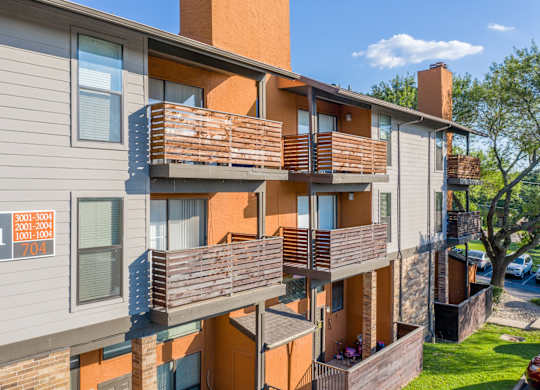 Apartment building with balconies at Vine Apartments in Arlington, TX