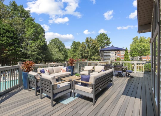 Clubhouse upstairs patio with couches and chairs at Wellington Ridge in Lawrenceville, GA