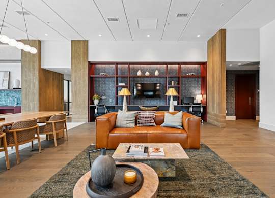 Leasing office lounge area with a couch and coffee table at Westdale Hills in Euless, TX