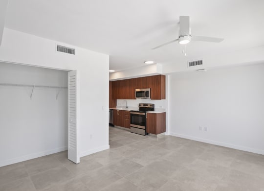 an open living space with kitchen and a loset at Westgate on University in Lauderhil, Fl