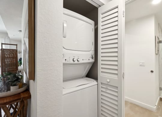 In-unit stacked washer and dryer in A2 Floor Plan at Westgate on University in Lauderhill, FL