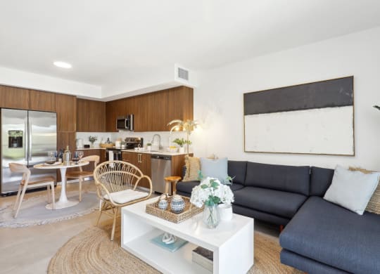 Living Room in A1 Floor Plan with L-Shaped Couch at Westgate on University in Lauderhill, FL