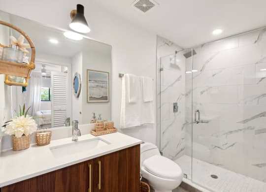 Bathroom with walk-in shower in B1 Floor Plan at Westgate on University in Lauderhill, FL