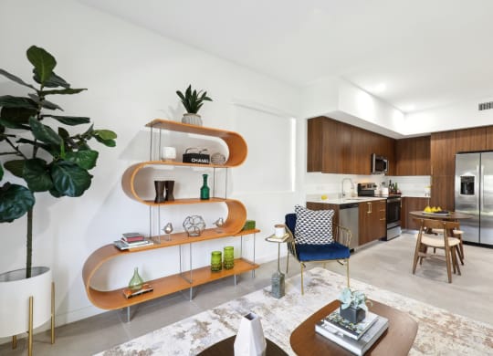 Living Room in A2 Floor Plan with wavy bookshelf at Westgate on University in Lauderhill, FL