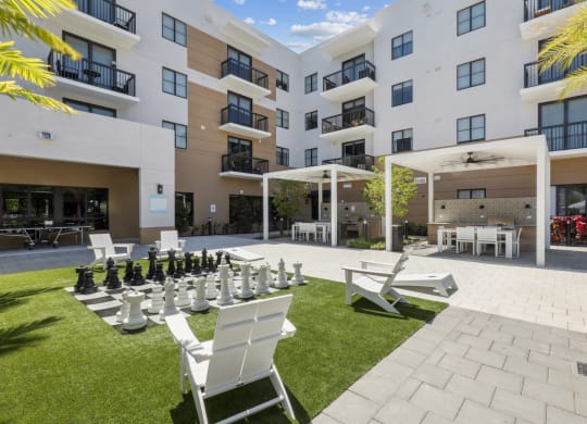 Green space and outdoor kitchen stations at Westgate on University in Lauderhill, FL