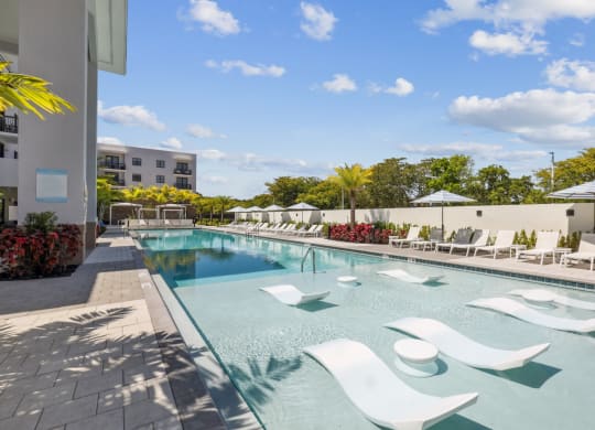 Resort-Inspired Pool with Cabanas and In-Pool Seating at Westgate on University in Lauderhill, FL