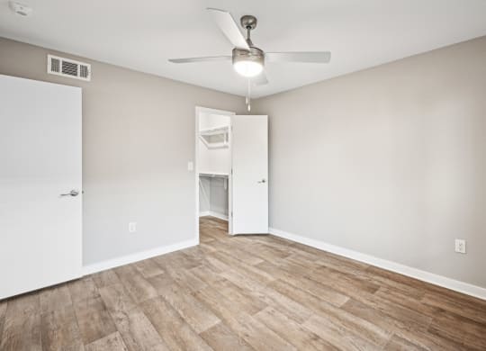 Serene bedroom area in the D5 floor plan at Windridge On The Parkway Apartments in Dallas, TX
