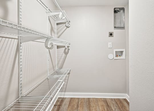 Convenient and spacious laundry closet in the D5 floor plan at Windridge On The Parkway Apartments in Dallas, TX